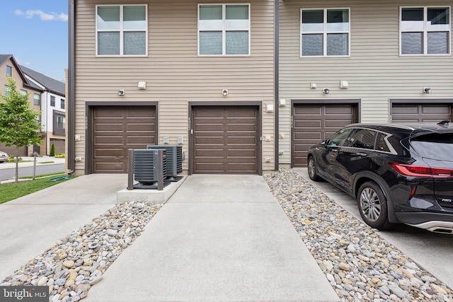 4902 Longmire Way Unit 24, Chantilly, VA 20151 - garage featuring driveway and central air condition unit