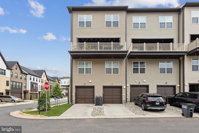 4902 Longmire Way Unit 24, Chantilly, VA 20151 - back of property with driveway, an attached garage, and a residential view