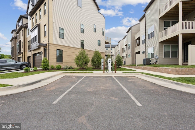 4902 Longmire Way Unit 24, Chantilly, VA 20151 - view of building exterior featuring uncovered parking, cooling unit, and a residential view