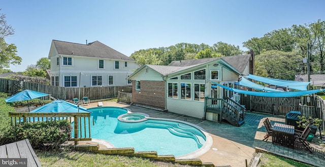 7306 Wayne Dr, Annandale, VA 22003 - rear view of property with a patio, a fenced backyard, and a pool with connected hot tub