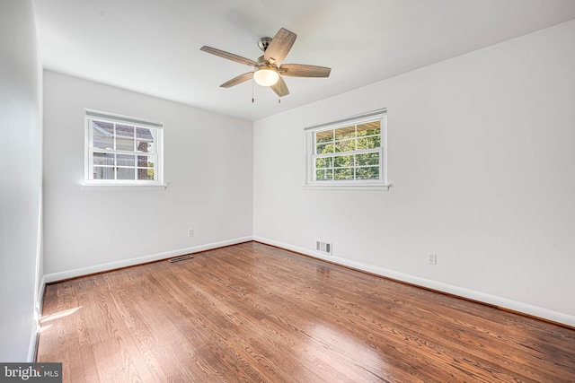 7306 Wayne Dr, Annandale, VA 22003 - empty room with a ceiling fan, baseboards, visible vents, and wood finished floors