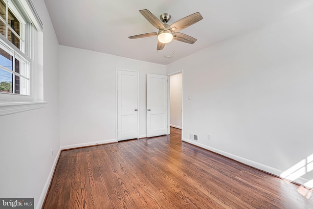 7306 Wayne Dr, Annandale, VA 22003 - unfurnished bedroom featuring baseboards, a ceiling fan, wood finished floors, and visible vents