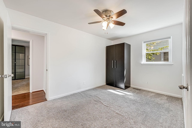 7306 Wayne Dr, Annandale, VA 22003 - unfurnished bedroom with baseboards, ceiling fan, and carpet flooring