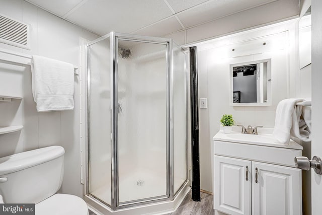 7306 Wayne Dr, Annandale, VA 22003 - bathroom with vanity, toilet, a shower stall, a drop ceiling, and visible vents