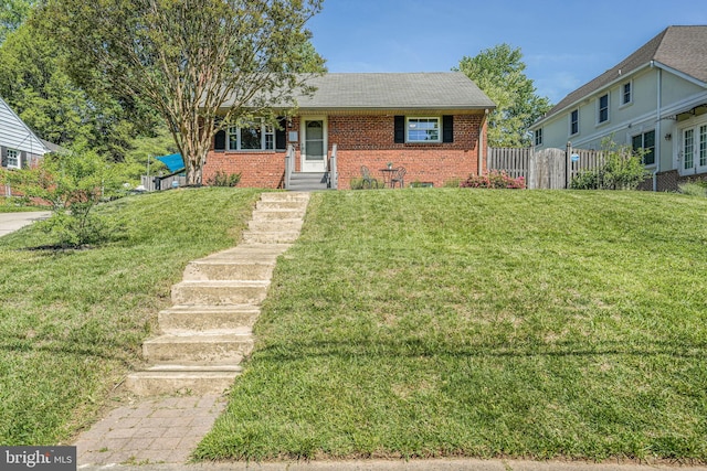 7306 Wayne Dr, Annandale, VA 22003 - bungalow featuring brick siding, fence, a shingled roof, and a front lawn