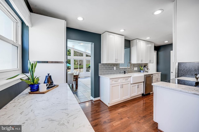 7306 Wayne Dr, Annandale, VA 22003 - kitchen with white cabinets, dark wood-style flooring, light stone countertops, a sink, and stainless steel dishwasher