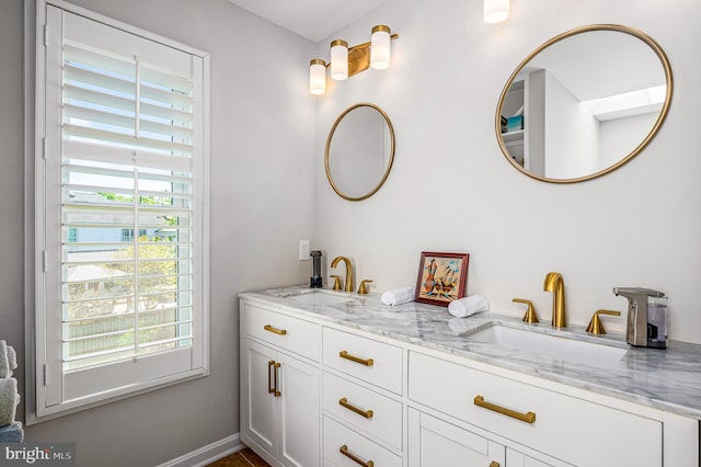 full bath featuring a sink and double vanity