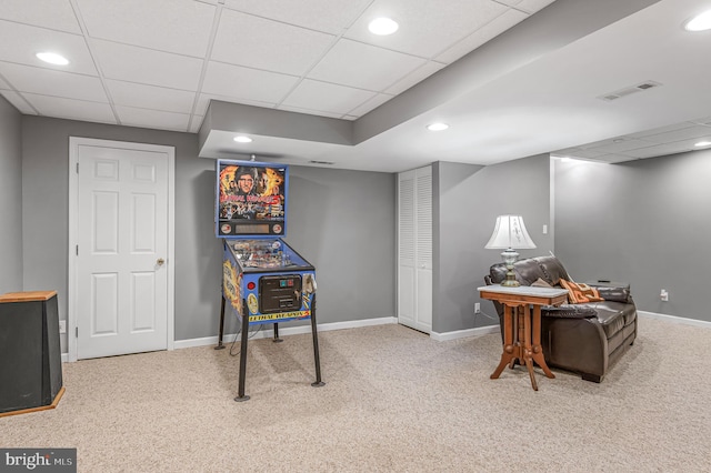 game room featuring visible vents, baseboards, carpet, and a drop ceiling