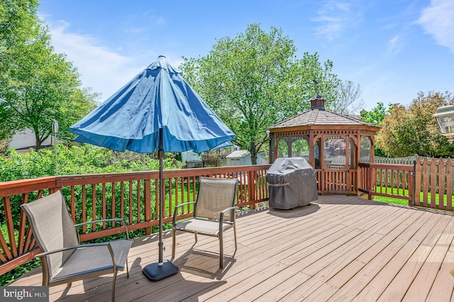 deck featuring grilling area and a gazebo