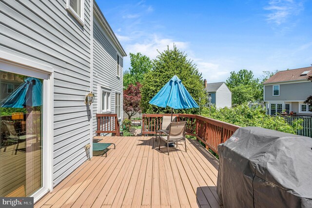wooden terrace featuring grilling area
