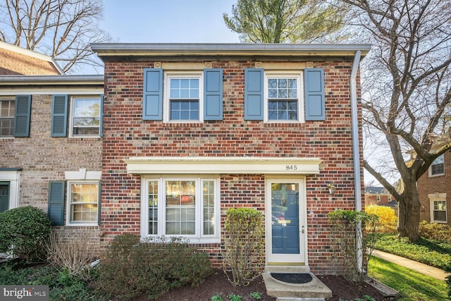 view of property with brick siding
