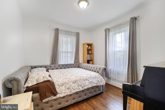 bedroom featuring dark wood finished floors