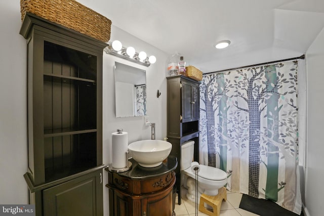 bathroom featuring vanity, toilet, tile patterned flooring, and a shower with shower curtain