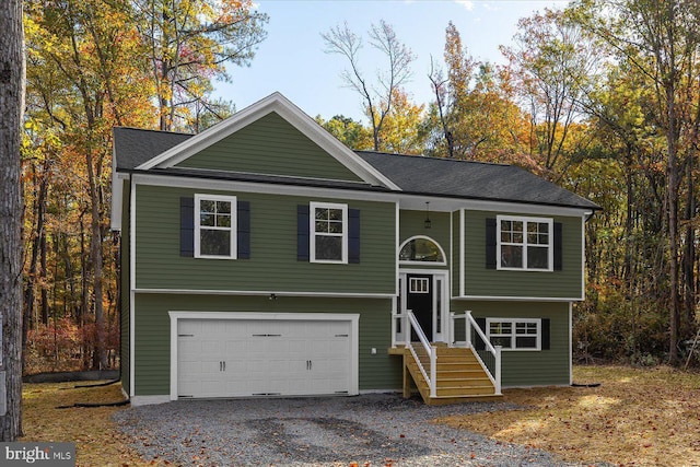 99 Boundary Dr, Stafford, VA 22556 - raised ranch with an attached garage and gravel driveway