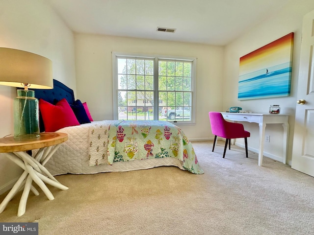 bedroom with baseboards, carpet flooring, and visible vents