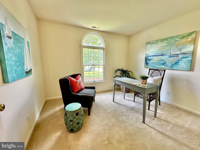 home office with visible vents, baseboards, and carpet flooring