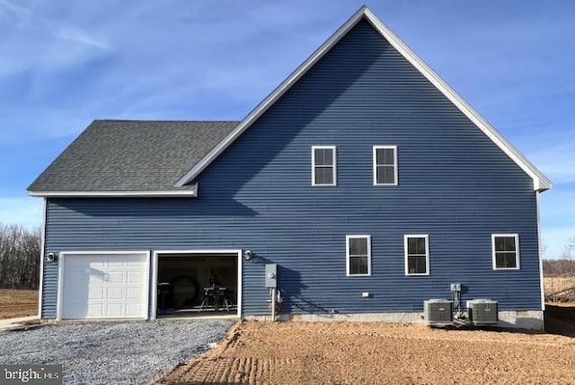 122B Garber, Mount Jackson, VA 22842 - back of house featuring cooling unit, driveway, and a shingled roof