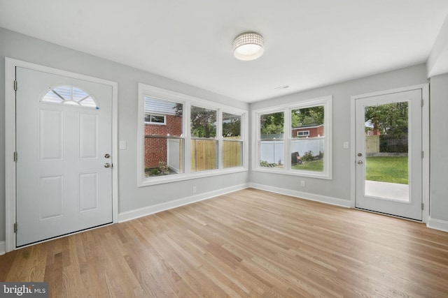 505 N Naylor St, Alexandria, VA 22304 - foyer entrance featuring light wood-type flooring, plenty of natural light, and baseboards