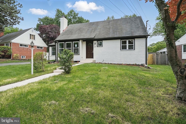 505 N Naylor St, Alexandria, VA 22304 - view of front of home with brick siding, a shingled roof, and a chimney