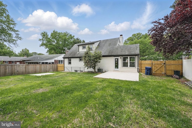 505 N Naylor St, Alexandria, VA 22304 - back of house with a patio area, a chimney, a gate, and central AC