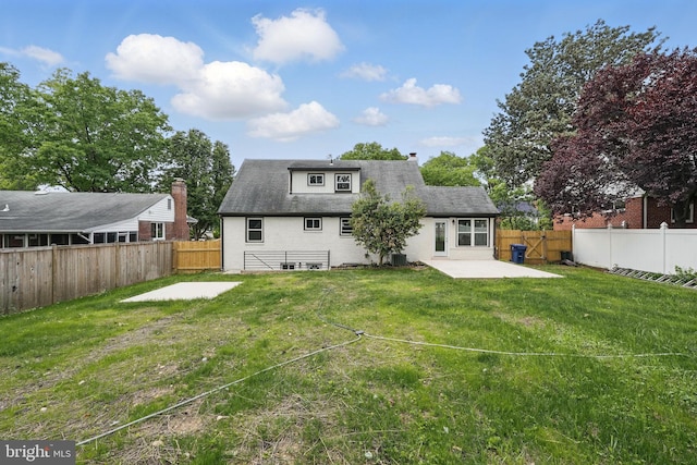 505 N Naylor St, Alexandria, VA 22304 - back of house featuring a patio and a chimney