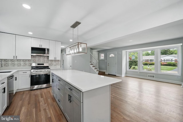 505 N Naylor St, Alexandria, VA 22304 - kitchen with stainless steel appliances, gray cabinets, light countertops, wood finished floors, and recessed lighting