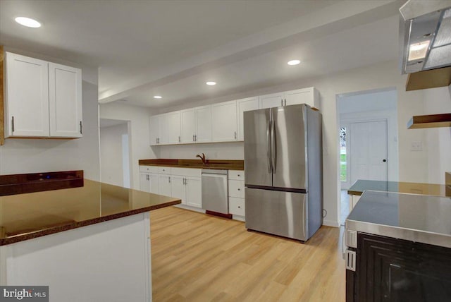 kitchen featuring recessed lighting, stainless steel appliances, light wood-style flooring, and white cabinets