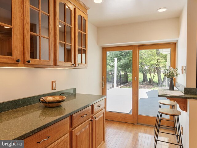 doorway to outside featuring recessed lighting and light wood-style flooring