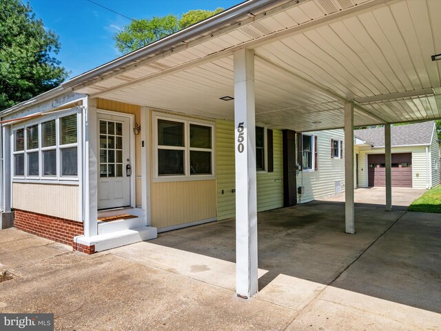 exterior space with driveway and a carport