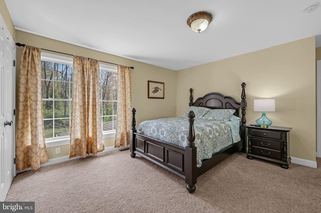 carpeted bedroom with baseboards