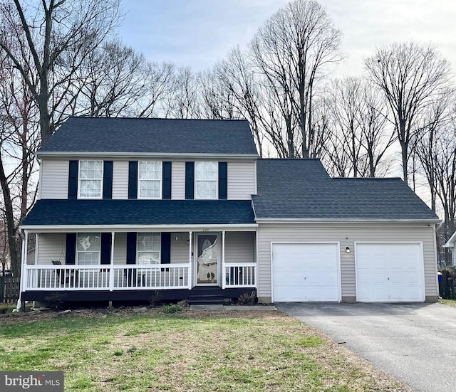 view of front of home featuring an attached garage, driveway, a porch, and roof with shingles