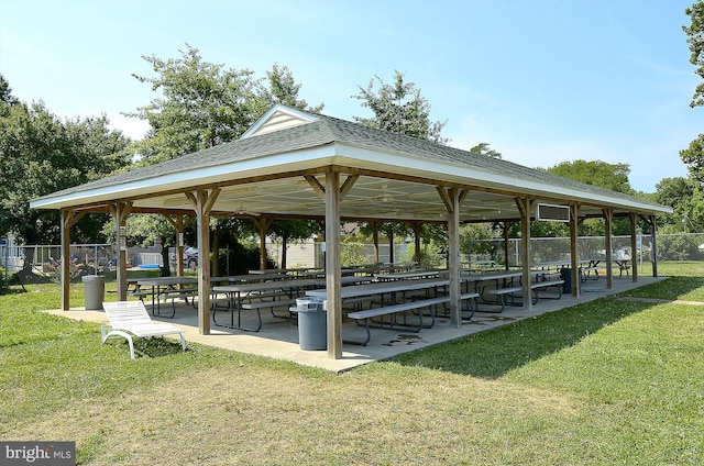 surrounding community featuring a gazebo, fence, and a yard