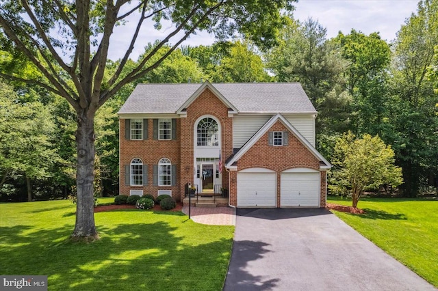 7625 Holbrook Ct, Manassas, VA 20112 - view of front of house featuring asphalt driveway, a front lawn, and brick siding
