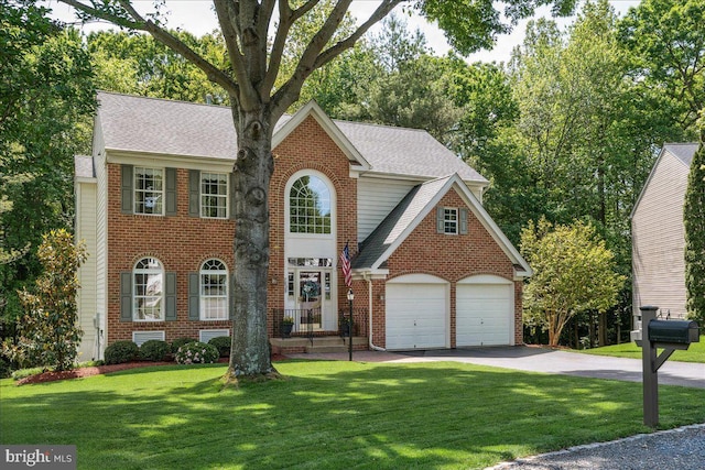 7625 Holbrook Ct, Manassas, VA 20112 - view of front of home with brick siding, asphalt driveway, a front lawn, and a shingled roof