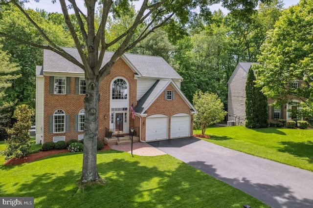 7625 Holbrook Ct, Manassas, VA 20112 - view of front of house featuring brick siding, driveway, and a front yard