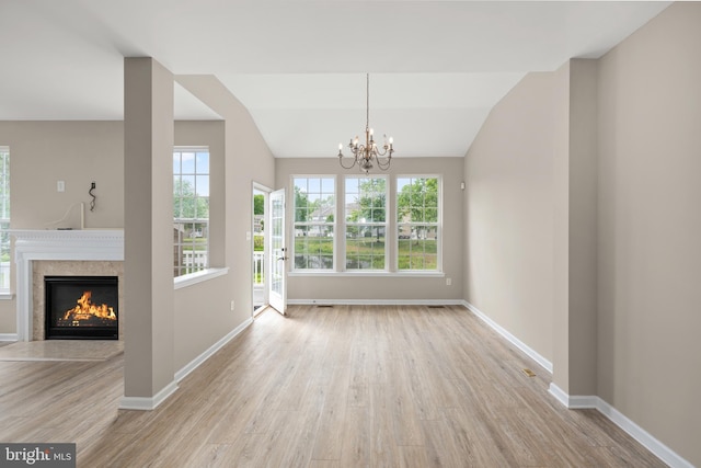 10023 Iron Pointe Drive Ext Unit 201B2, Millsboro, DE 19966 - unfurnished living room with wood finished floors, plenty of natural light, baseboards, and lofted ceiling