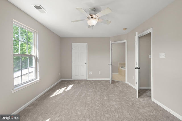 10023 Iron Pointe Drive Ext Unit 201B2, Millsboro, DE 19966 - unfurnished bedroom with carpet floors, baseboards, and connected bathroom