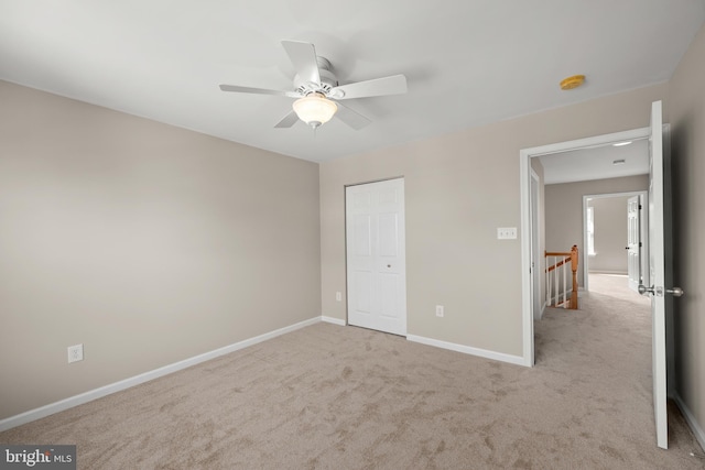 10023 Iron Pointe Drive Ext Unit 201B2, Millsboro, DE 19966 - unfurnished bedroom with carpet flooring, baseboards, a ceiling fan, and a closet