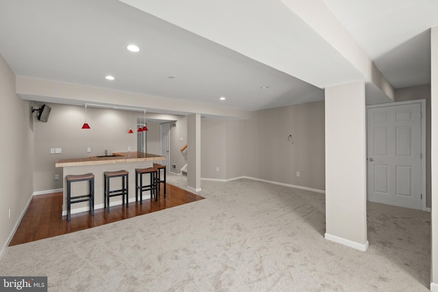 10023 Iron Pointe Drive Ext Unit 201B2, Millsboro, DE 19966 - finished below grade area featuring baseboards, carpet flooring, wet bar, recessed lighting, and stairs