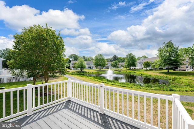 10023 Iron Pointe Drive Ext Unit 201B2, Millsboro, DE 19966 - wooden terrace featuring a water view and a lawn
