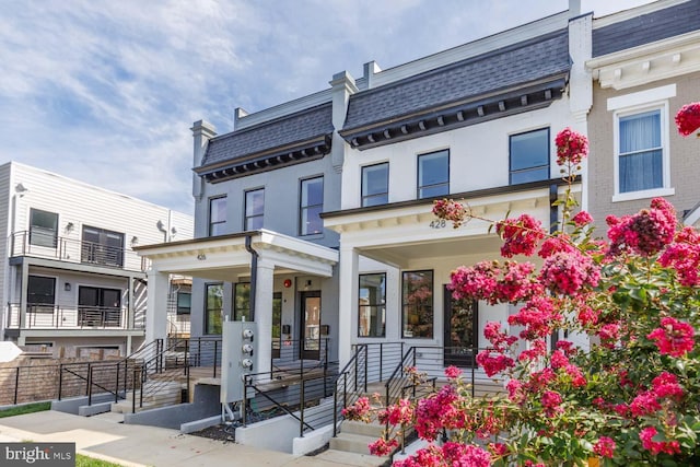 426 Manor Pl NW Unit 3, Washington, DC 20010 - back of property with mansard roof, a porch, and brick siding