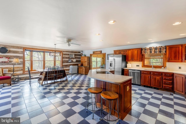 1460 Pitcock Ln, Winchester, VA 22602 - kitchen featuring dark floors, ceiling fan, light countertops, and stainless steel appliances