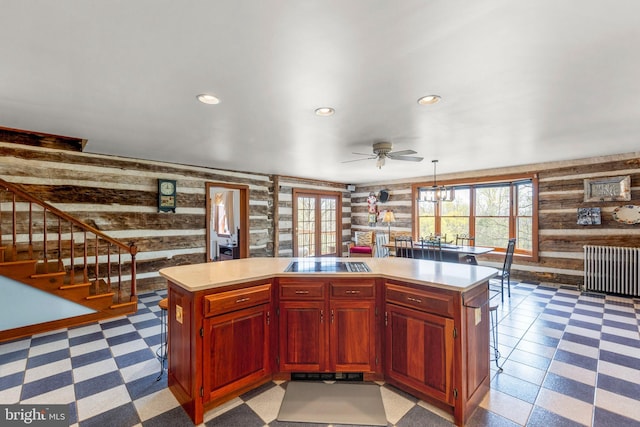 1460 Pitcock Ln, Winchester, VA 22602 - kitchen featuring radiator, ceiling fan, recessed lighting, wooden walls, and black electric cooktop