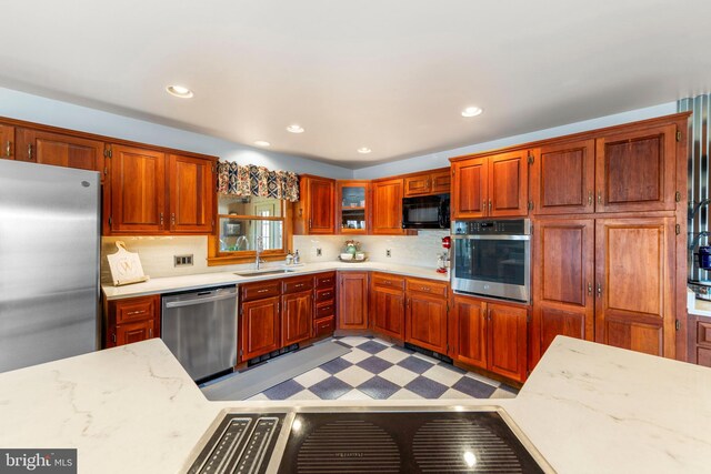 1460 Pitcock Ln, Winchester, VA 22602 - kitchen with light floors, recessed lighting, appliances with stainless steel finishes, a sink, and backsplash