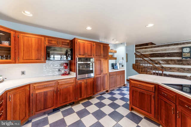 1460 Pitcock Ln, Winchester, VA 22602 - kitchen featuring tasteful backsplash, light countertops, oven, and light floors