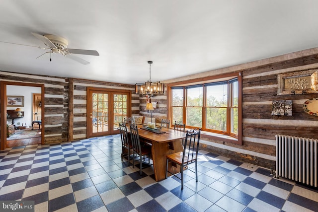1460 Pitcock Ln, Winchester, VA 22602 - dining space with wooden walls, french doors, radiator, and dark floors