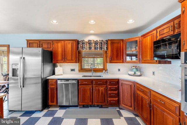 1460 Pitcock Ln, Winchester, VA 22602 - kitchen with a sink, a healthy amount of sunlight, decorative backsplash, and stainless steel appliances