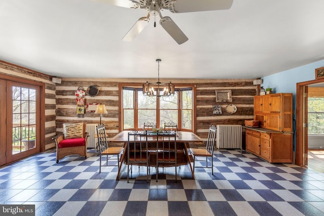 1460 Pitcock Ln, Winchester, VA 22602 - dining room featuring a wealth of natural light, wooden walls, radiator, and dark floors
