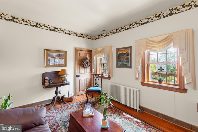 1460 Pitcock Ln, Winchester, VA 22602 - sitting room featuring radiator heating unit, visible vents, baseboards, and wood finished floors