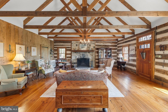 1460 Pitcock Ln, Winchester, VA 22602 - living room featuring wooden walls, wood-type flooring, and a healthy amount of sunlight